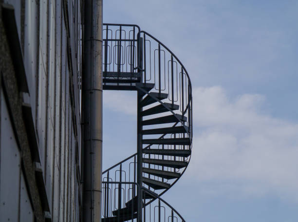 istock Low angle view of spiral staircase against sky 1488657695