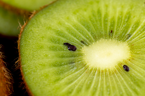 Green fresh kiwi during cooking, fresh green kiwi while cooking food in the kitchen