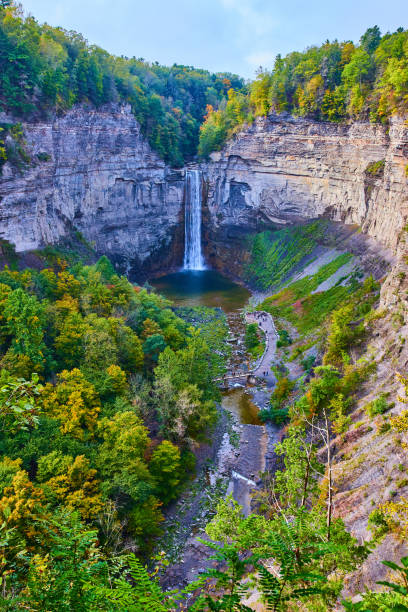 istock Giant canyon with large waterfall flowing into it and surrounded by fall forests.jpg 1488663064