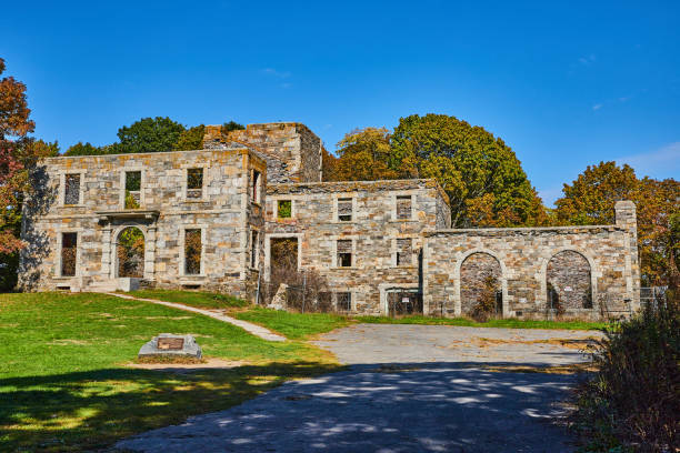 istock Old abandoned stone structure in forest with arches and open windows.jpg 1488666031