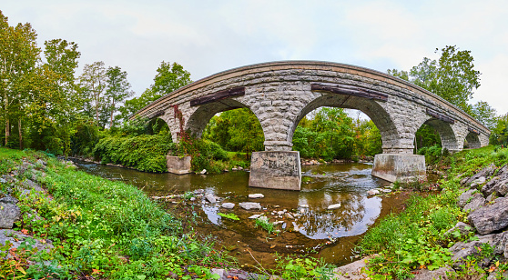 Image of Panorama of 5 arched stone bridge for train track over river