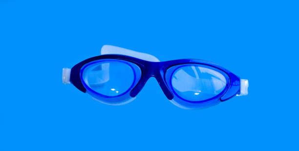 istock Swimming goggles sport summer on a blue background 1488667612