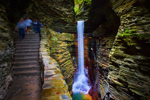 Stone steps lead around and beyond amazing waterfall in gorge of Upstate New York.jpg Image of Stone steps lead around and beyond amazing waterfall in gorge of Upstate New York watkins glen stock pictures, royalty-free photos & images