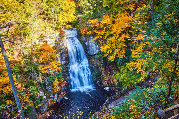 istock Stunning waterfall tucked into peak fall forest with boardwalk trails overlooking.jpg 1488667987