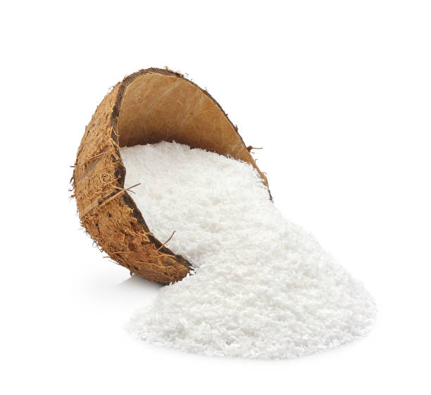 fiocchi di cocco in guscio isolati su bianco - powdered coconut foto e immagini stock