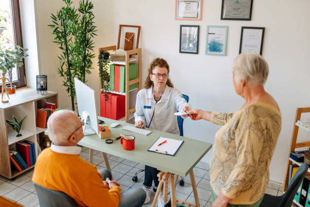 istock Old people at doctor visit 1488675815