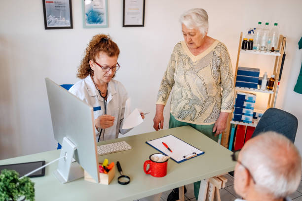 istock Old people at doctor visit 1488675880