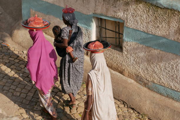 Harari women walk to market stock photo