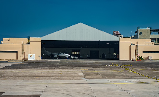 Hangar with a small private jet inside.