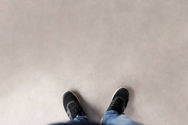 Feet standing on the ground​​​ foto