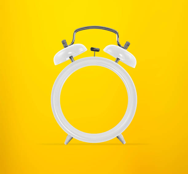 istock Living coral alarm clock with empty face, no hands, on yellow background. Minimal creative concept 1488693289