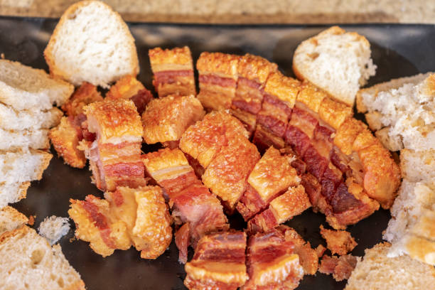 TRADITIONAL TORREZNOS DISH FROM SORIA, SPAIN READY TO EAT. TORREZNOS DISH FROM SORIA, SPAIN, READY TO EAT. TYPICAL SPANISH FOOD CONSISTING OF FRIED PORK BACON RINDS. spanish breakfast stock pictures, royalty-free photos & images