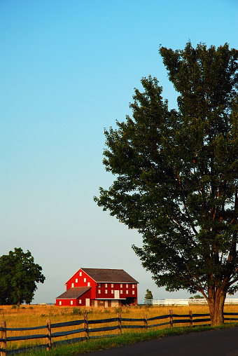 A lone red barn stands in a field and once saw a decisive victory in the American Civil War at Gettysburg National Military Park