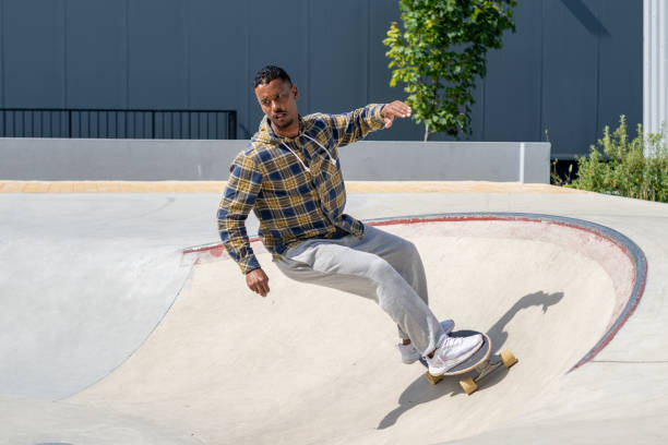 istock Surf skater performing a turn on a skatepark 1488707319