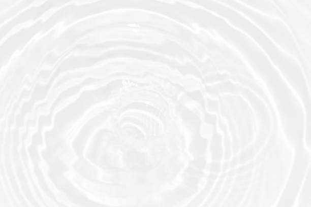 istock White water with ripples on the surface. Defocus blurred transparent white colored clear calm water surface texture with splashes and bubbles. Water waves with shining pattern texture background. 1488707591