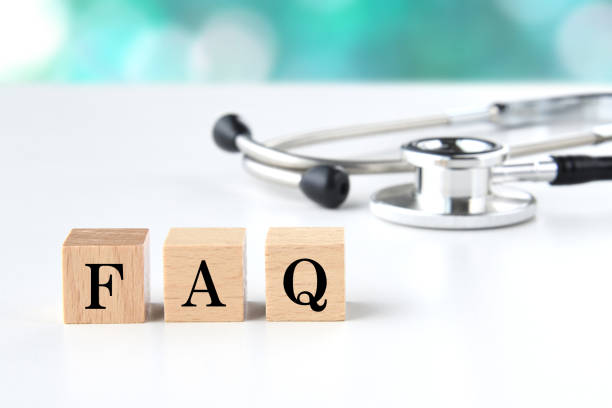 istock Stethoscope and wooden blocks with FAQ word 1488717459