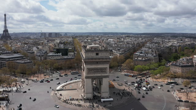 Aerial crane shot of famous Arc de Triomphe and Eifel Tower, Paris