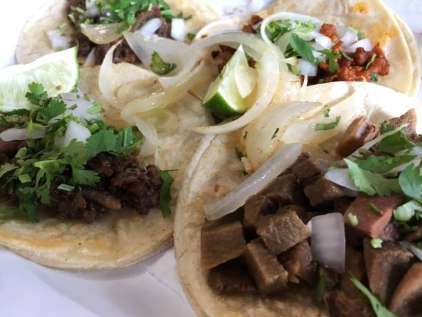 istock Mexican tacos (tongue, barbacoa, al pastor), ready to eat. 1488729337