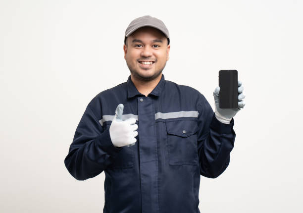 istock Technician workers in uniform maintenance service with smartphone. Profession of service industry house repair. Home services with cellphone isolated background. 1488730231