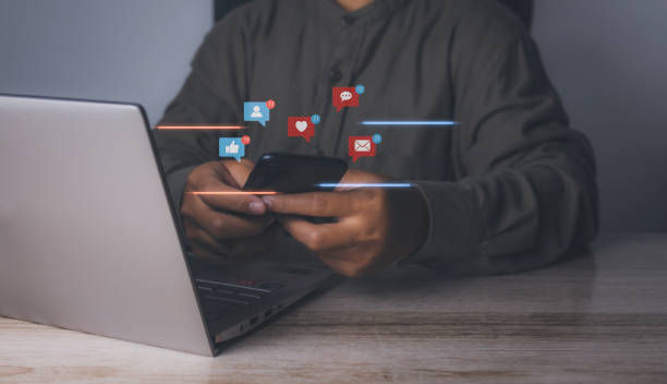 istock Man using smartphone with social media to interactions icon. 1488732163