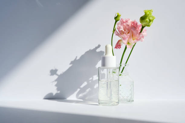 istock Serum with a dropper with spring flowers. 1488733248