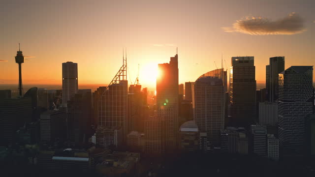 4K Aerial view Real time Footage of Sydney City various building in Central Business District when sunrise time with airplane, Sydney