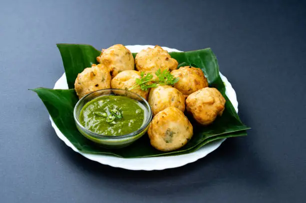 An extremely popular deep-fried snack recipe from the south indian cuisine made with plain flour. it is known for its round ball-shaped soft texture and hence the name of bajji or bonda recipe
