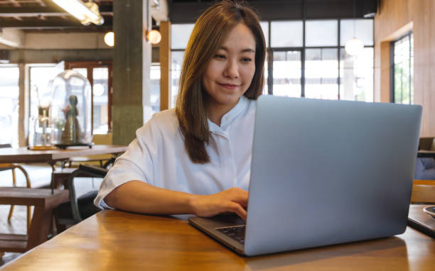 istock Portrait image of a young woman working on laptop computer 1488743552