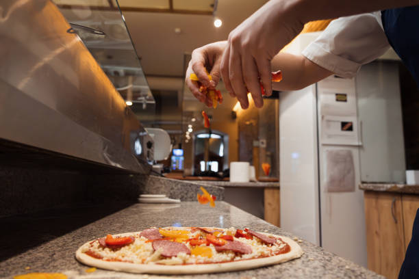 istock Food concept. Preparing traditional italian pizza 1488761796