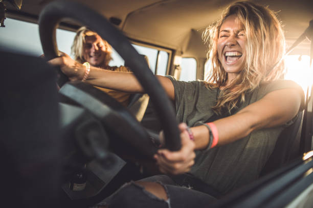 istock Young happy couple enjoying in road trip. 1488763182