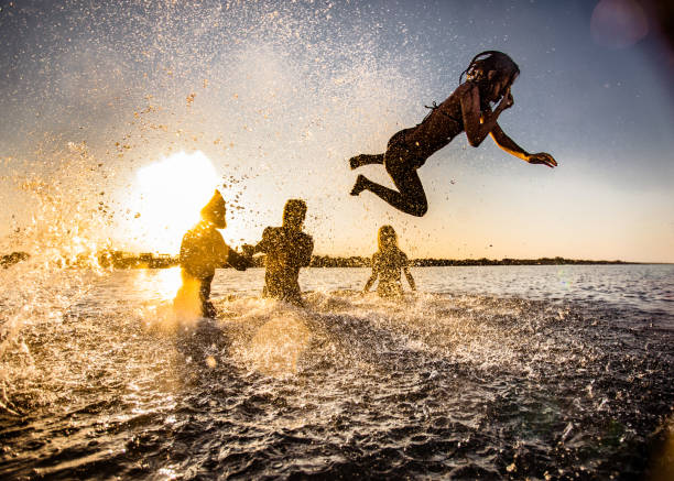istock Fun in the sea at sunset! 1488763868