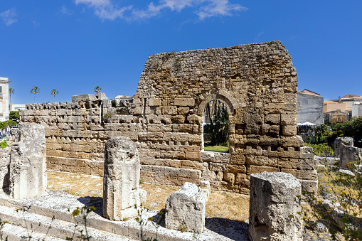Syracuse, Sicily, Italy - April 29, 2023: Remains of Temple of Apollo at Piazza Pancali. It is one of the most important ancient Greek monuments on Ortygia island