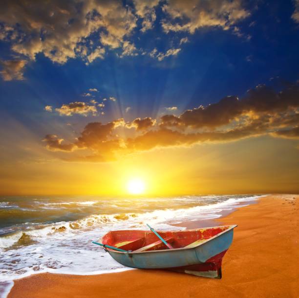 istock small boat on a sea coast at the sunset 1488764885
