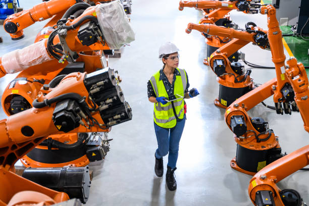 istock Female business owner engineer managing and checking work at factory 1488766039