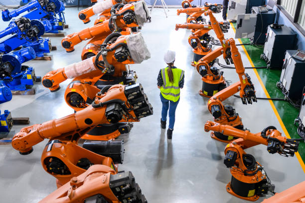 istock Female business owner engineer managing and checking work at factory 1488766435