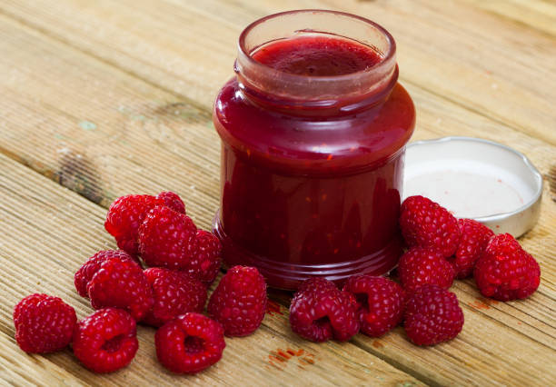 Image of tasty  raspberry jam in jar and fresh  berries on wooden surface Image of tasty  raspberry jam in jar and fresh  berries on wooden surface, nobody raspberry jam stock pictures, royalty-free photos & images