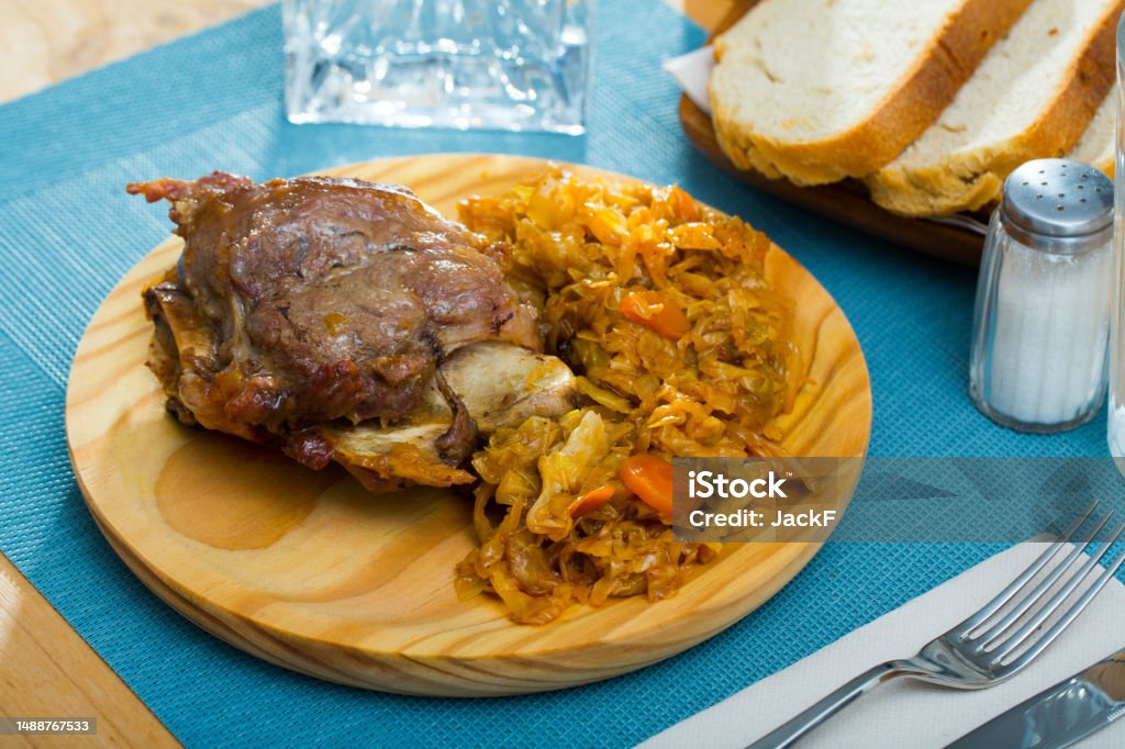 Spanish dish galtas al horno Pork cheeks with braised cabbage, original catalonian dish Galtas al horno Appetizer Stock Photo