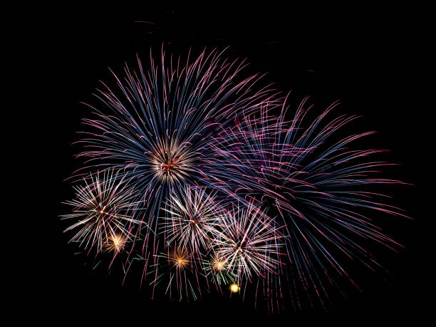 istock Multiple fireworks against the deep black sky. Bright  display of the fireworks 1488770367