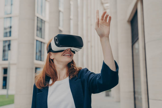 istock Redhead businesswoman managing business project through virtual reality platform 1488773838