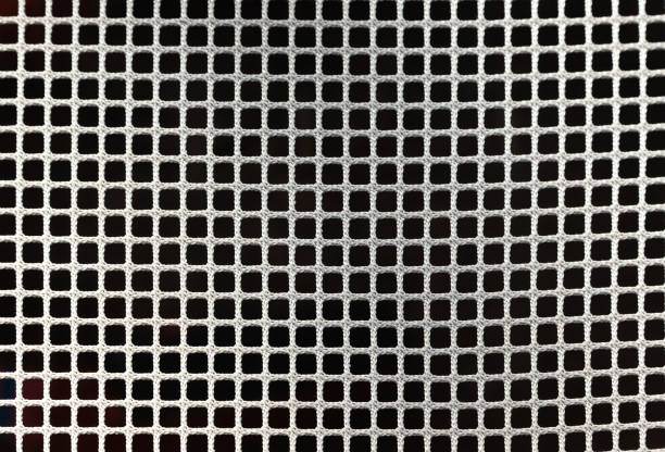 White mesh on black. Cellular grid of white color on a black background.