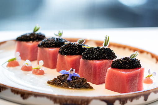 Macro close up detail of appetizing blue fin tuna sashimi with Beluga caviar