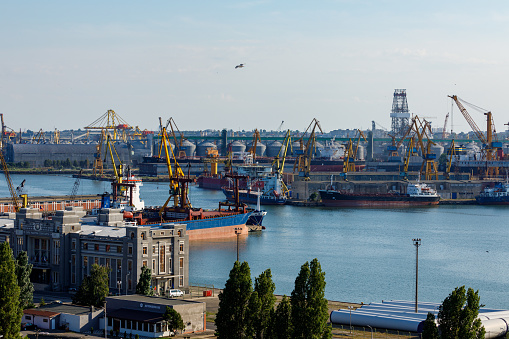 Aerial view of cargo ship at port.