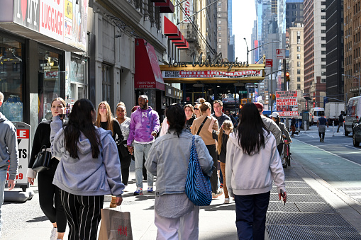 New York, USA, April 10, 2023 - Tourists and locals on 7th Avenue in Midtown Manhattan, New York.