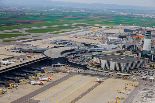 MAY 27 2023 Vienna Austria. View of parking planes and terminals at VIE international airport from the air