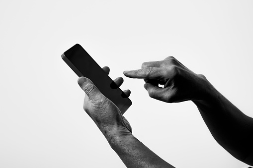 Black and white photo of wrinkled hands of senior generation