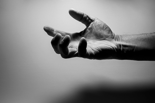 Black and white photo of wrinkled hands of senior generation