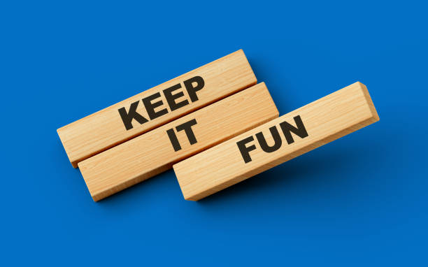 istock Keep It Fun Text On Wooden Blocks Isolated On Blue Background, 3d illustration 1488780993