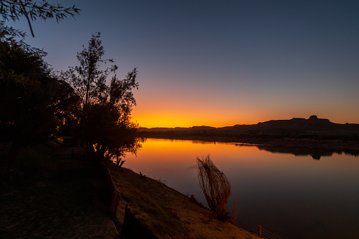 Sunset over the Orange river, on the border between Namibia and South Africa.