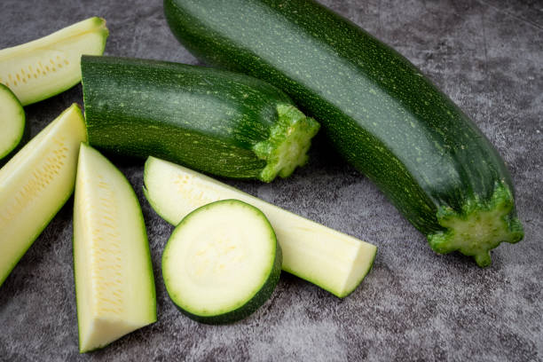istock Fresh sliced zucchini on a black background 1488783038