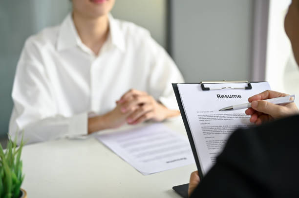 istock A recruiter or HR manager reading a candidate's resume during a job interview. 1488784111